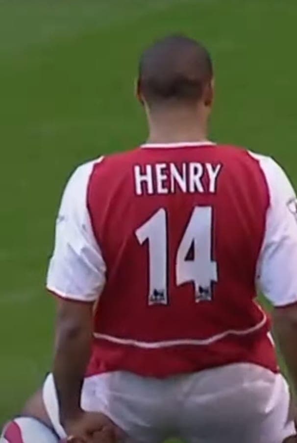 Thierry Henry's iconic knee-slide celebration, a defining image of the Wenger era