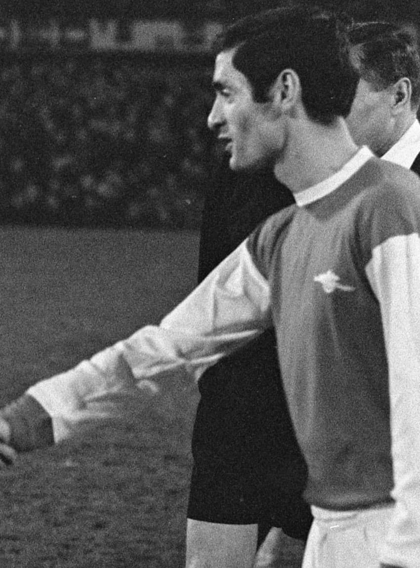 Frank McLintock, as Arsenal captain, shaking hands with the opposing captain before a match, late 1960s