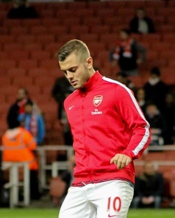 Jack Wilshere warming up in Arsenal kit before a match against Manchester United, February 2014