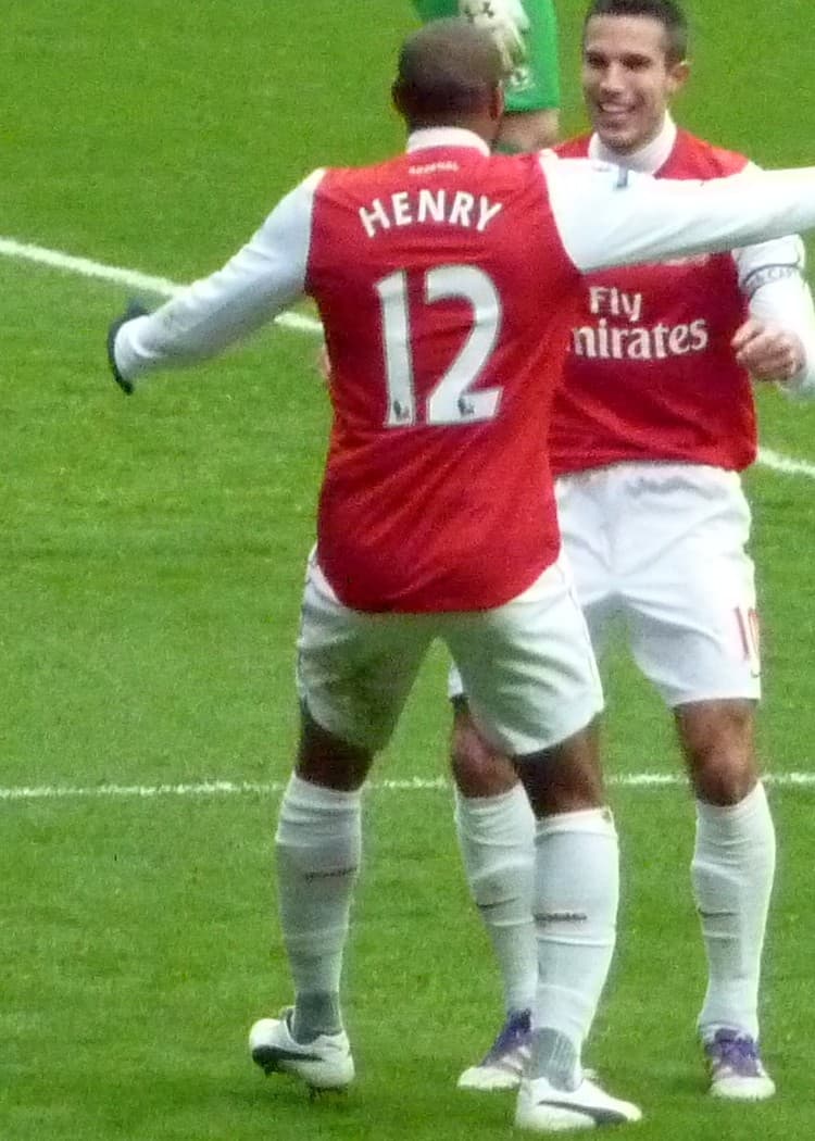 Thierry Henry, identified by name and number on his shirt, celebrating during his brief loan return to Arsenal in February 2012